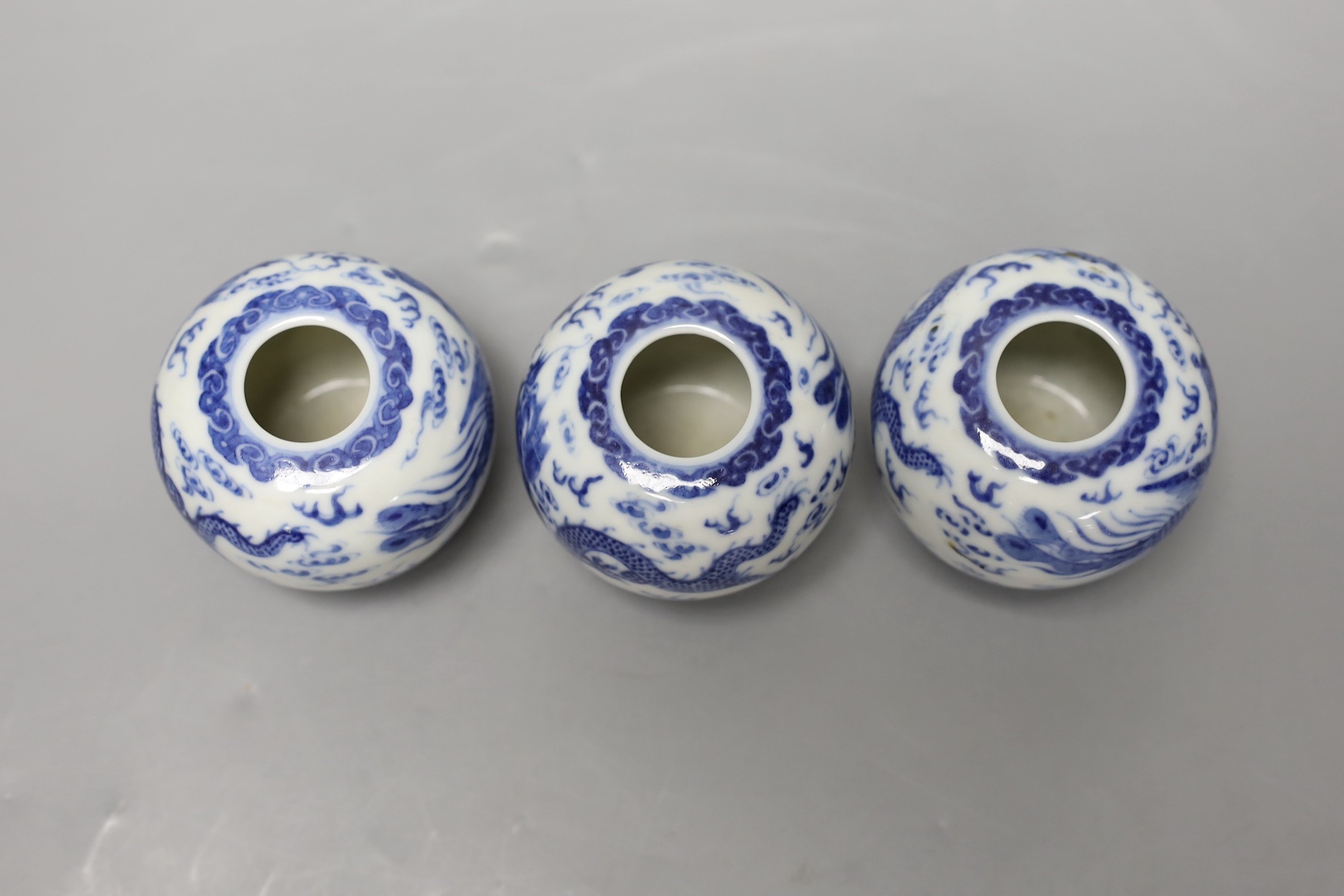 Three Chinese blue and white 'dragon and phoenix' waterpots, probably Republic period, 6cm